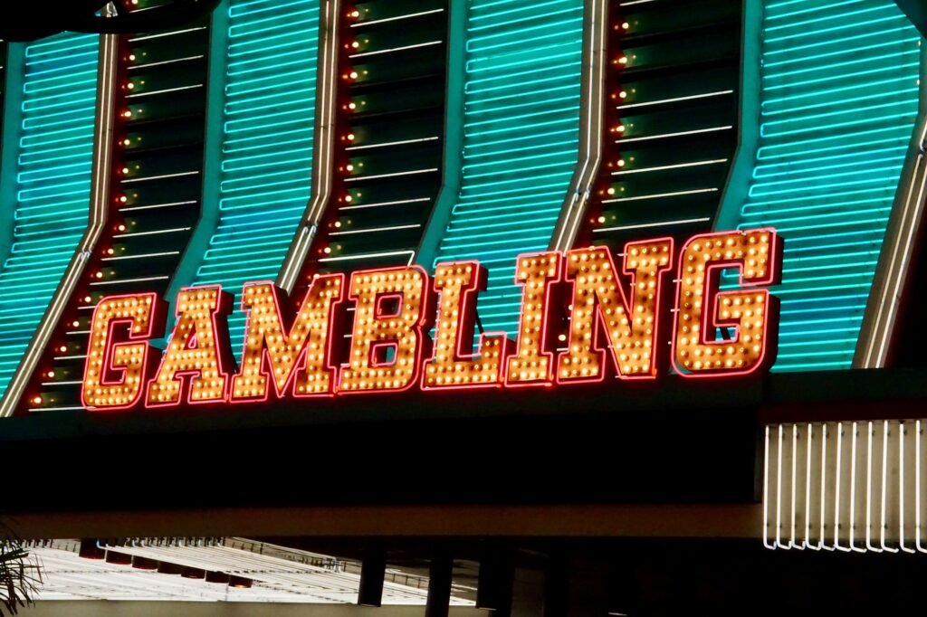 Gambling Sign in Front of Neon Lights